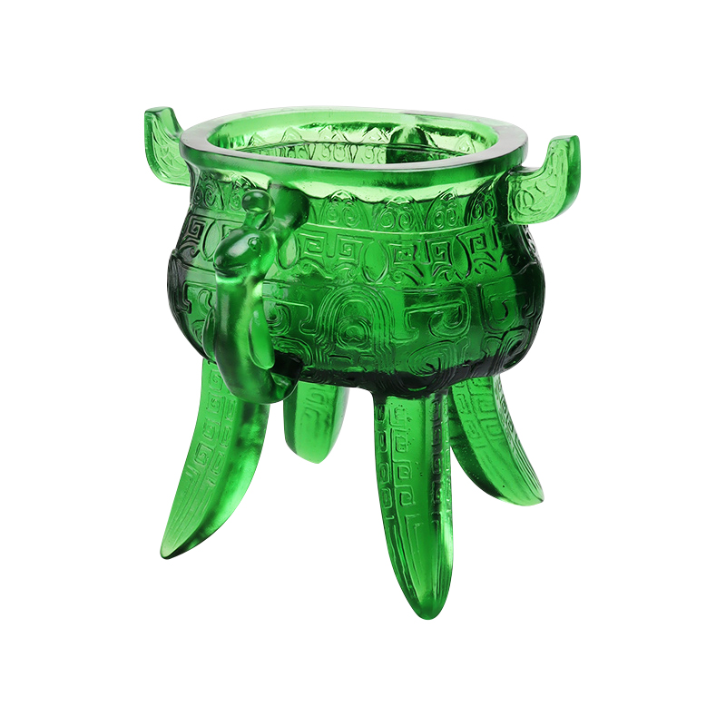 Smaragdgrönt stativ i kristallglas med öronformade handtag