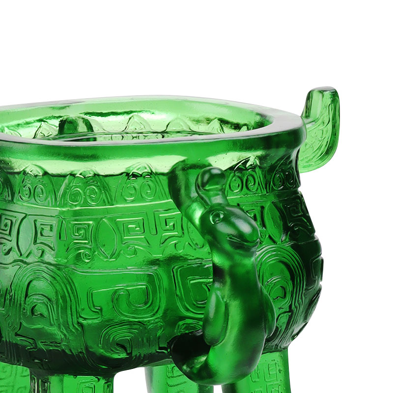 Smaragdgrönt stativ i kristallglas med öronformade handtag