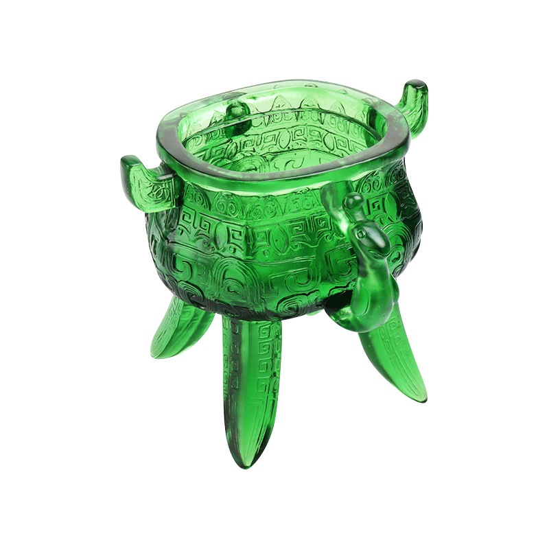 Smaragdgrönt stativ i kristallglas med öronformade handtag