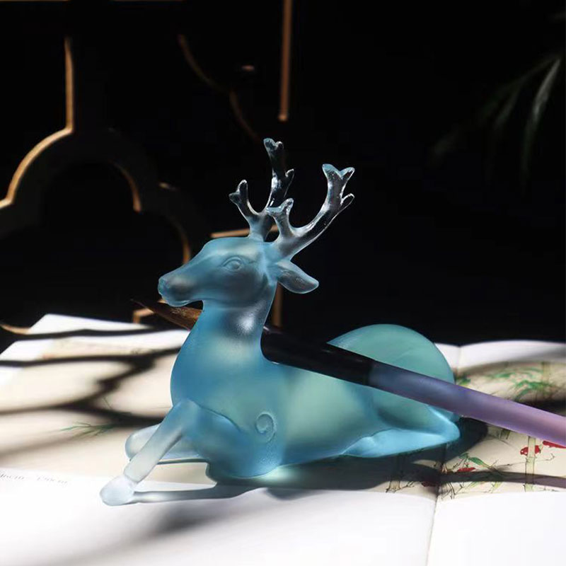Hjortformad borsthållare i blått glas