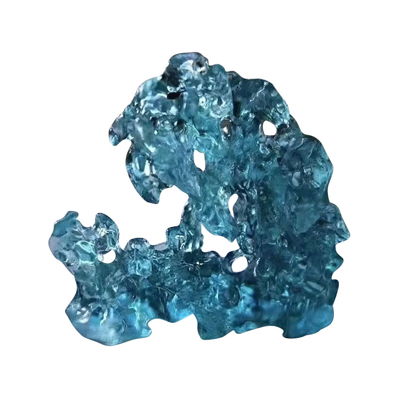 Stenformade blåfärgade glasprydnader