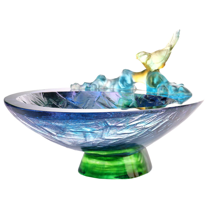 Fruktskål i kristallglas med fågeldekoration