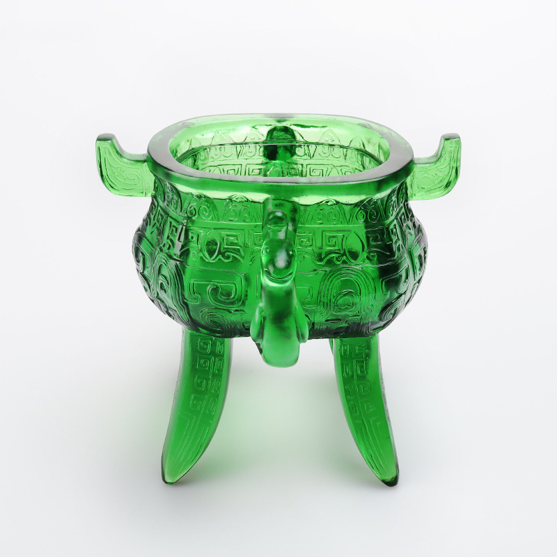 Smaragdgrönt stativ i kristallglas med öronformade handtag