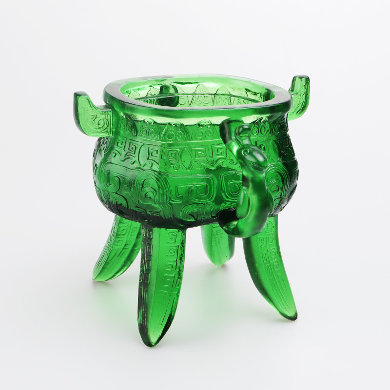 Smaragdgrönt stativ i kristallglas med öronformade handtag