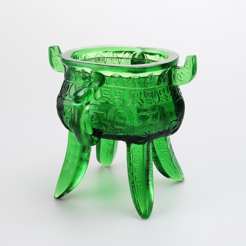 Smaragdgrönt stativ i kristallglas med öronformade handtag